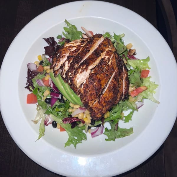 Bailey's Smokehouse BBQ chicken salad with avocado, corn, black beans, and red onion.